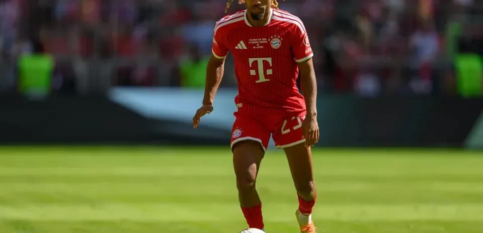 Bayern Munich player dribbling the ball on field