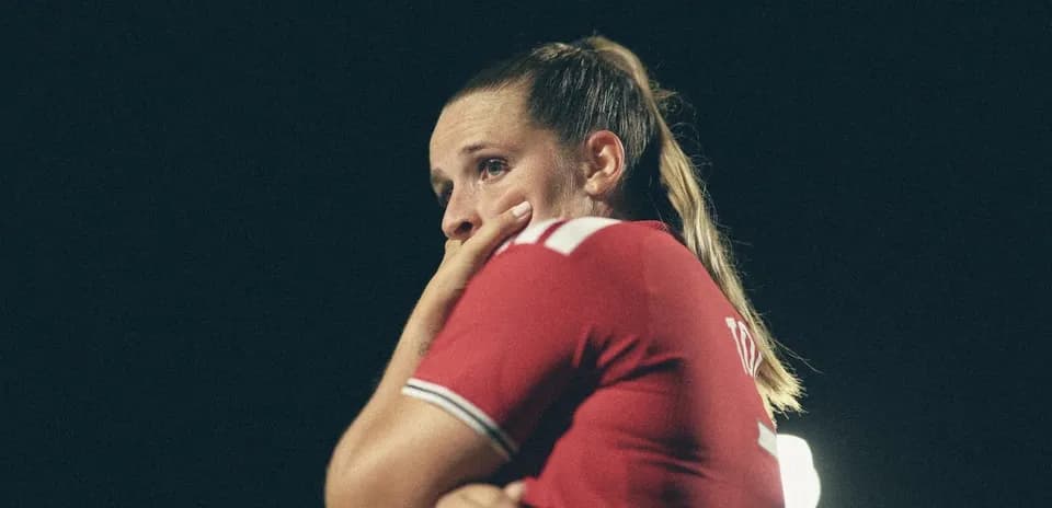 Player in red jersey during a night match