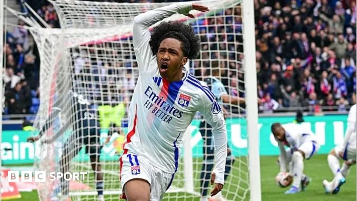 Player celebrating a goal in front of the net