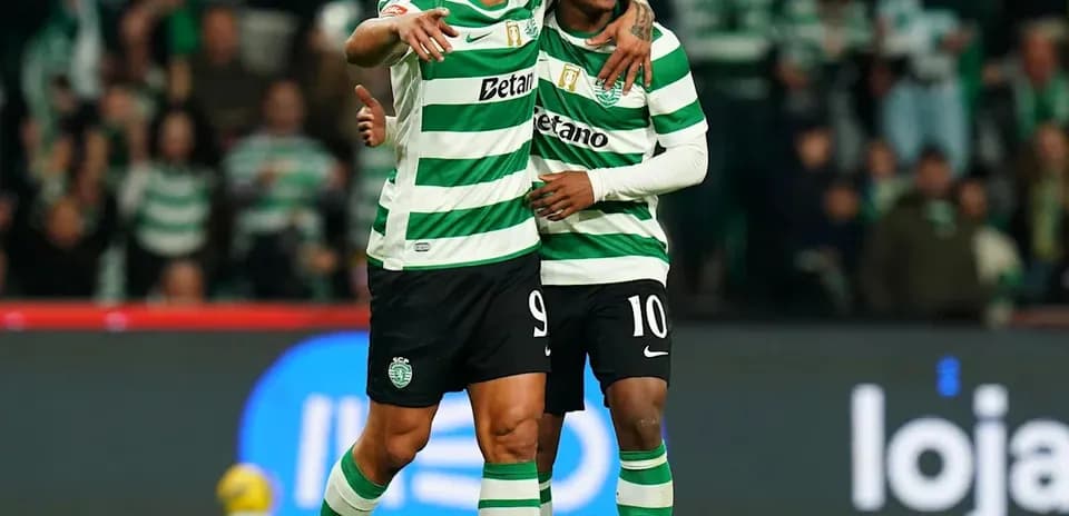 Two players celebrating on the field during match