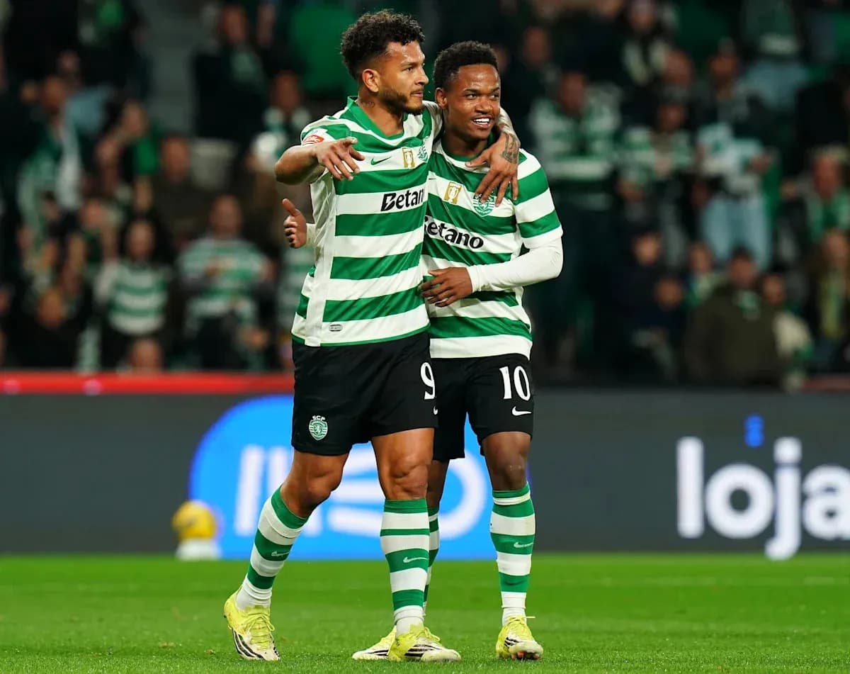 Two players celebrating on the field during match
