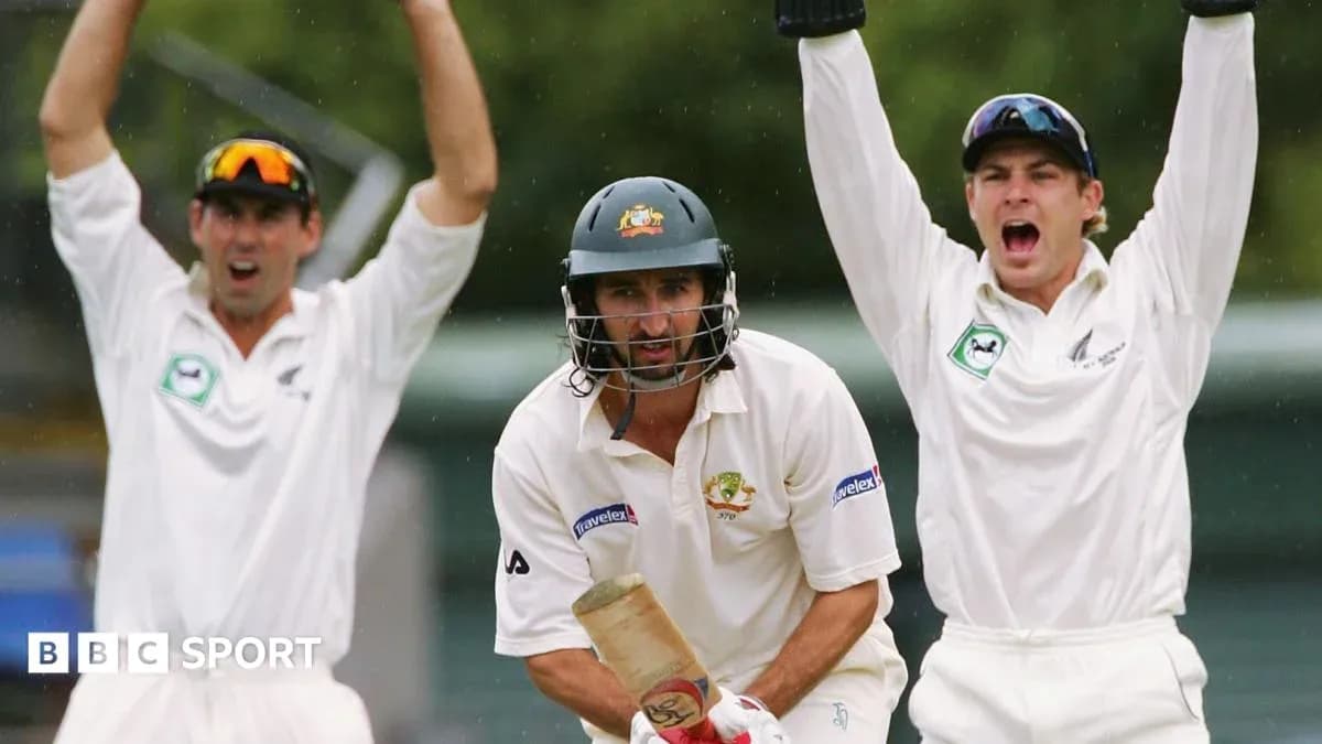 Batsman facing delivery with fielders celebrating behind