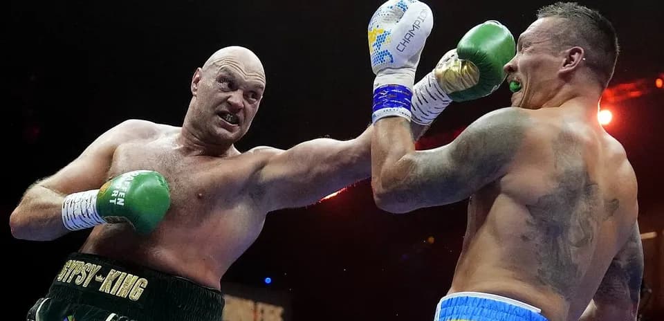 Boxers exchanging punches in a boxing match