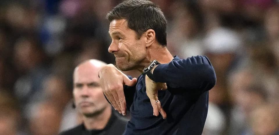 Coach gesturing on the sideline during match