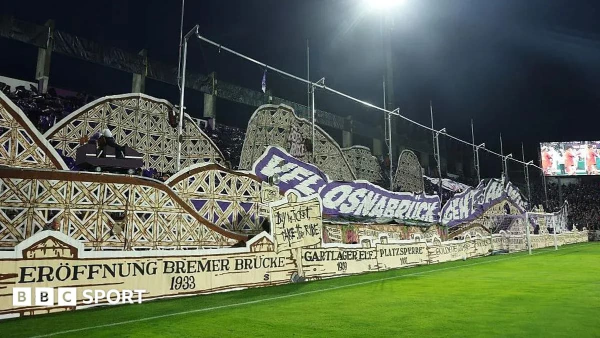 Fan banners displayed in stadium during match
