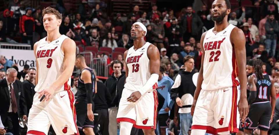 Miami Heat players walking off the court after game