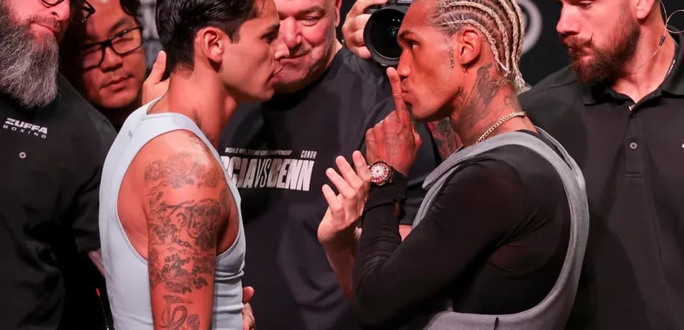 Two boxers face-off during pre-fight weigh-in