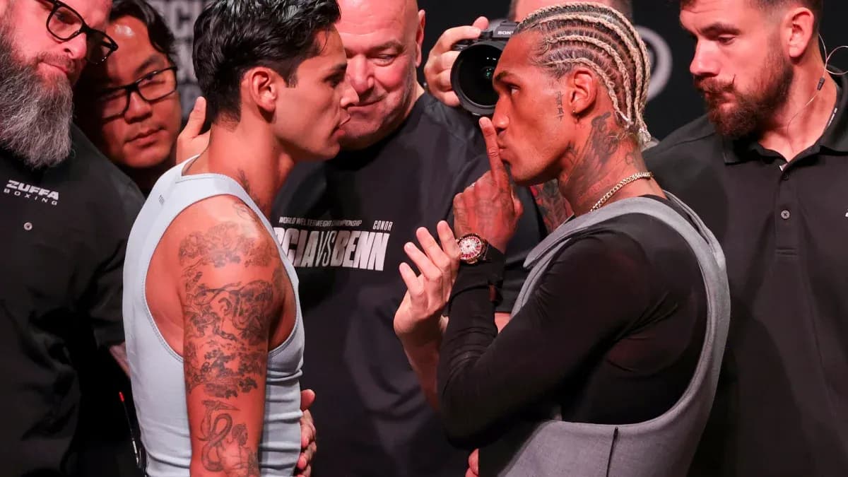 Two boxers face-off during pre-fight weigh-in