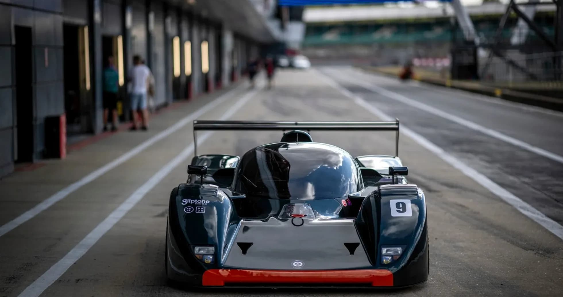 Racing car in pit lane at racetrack