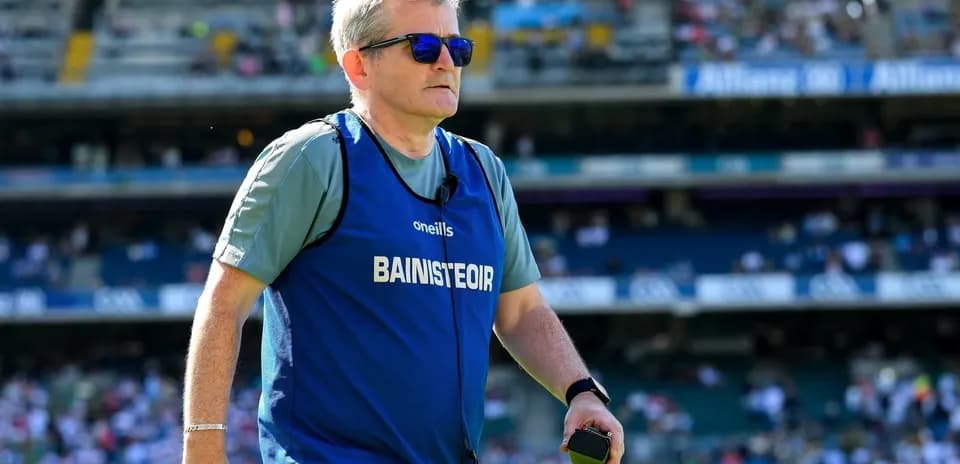 Coach wearing sunglasses during a match warm-up