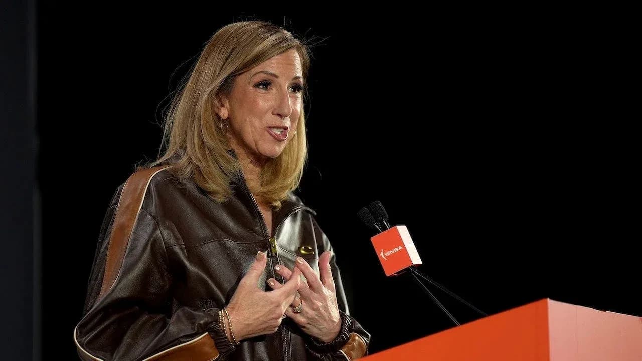 Woman speaking at a podium during event