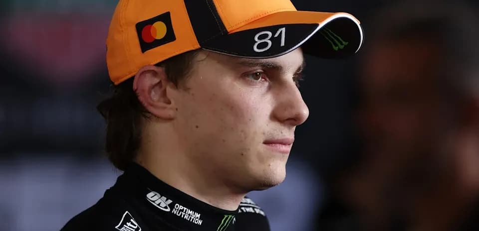 Driver wearing an orange cap during an event