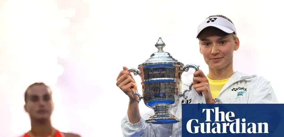 Player holding trophy with runner-up in background