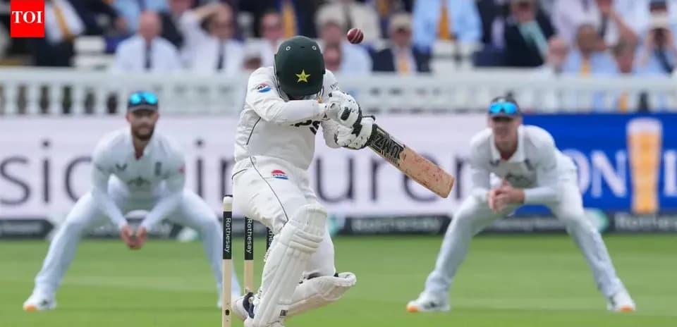 Batsman facing delivery with wicketkeeper and fielders nearby