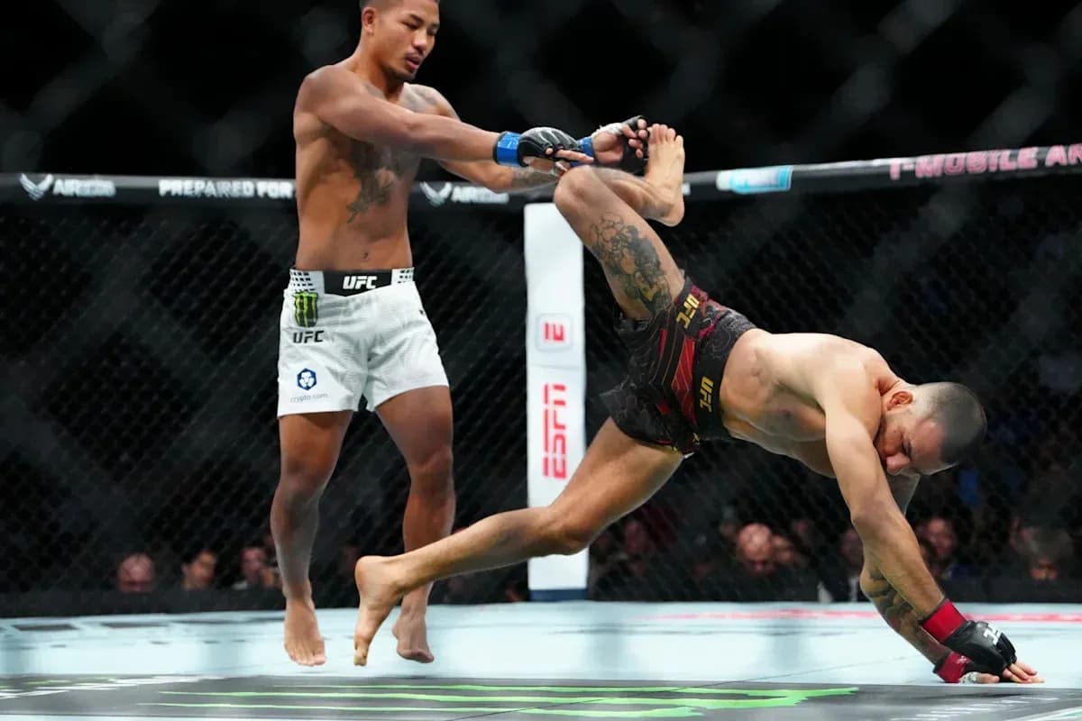 Fighter executing a takedown in UFC match