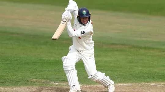 Batsman playing a shot on the cricket field