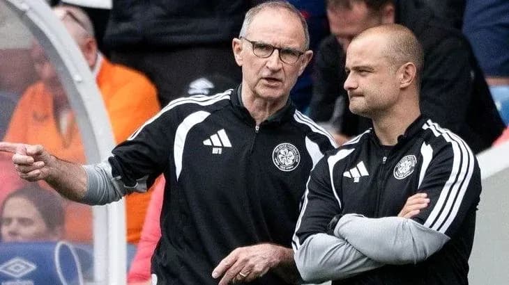 Coaches discussing strategy during a match