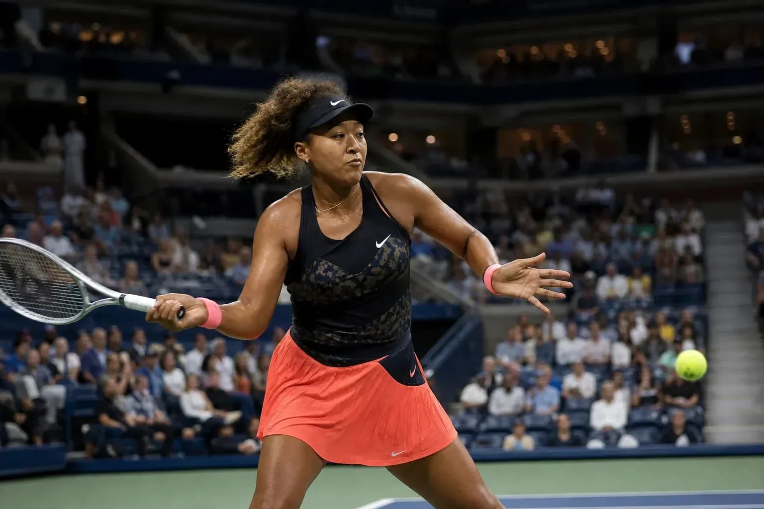 Naomi Osaka hitting a forehand during a match