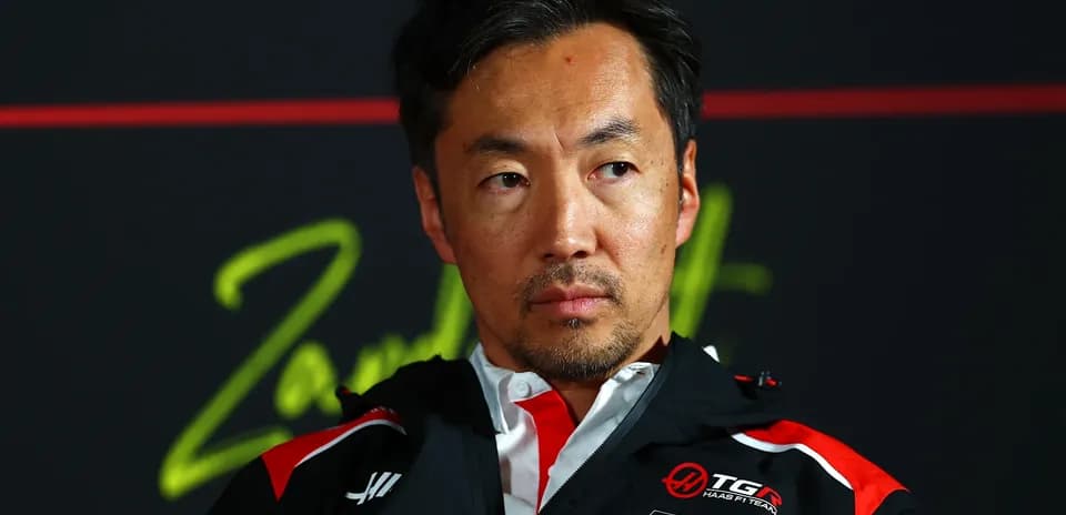 Team manager during press conference with branding