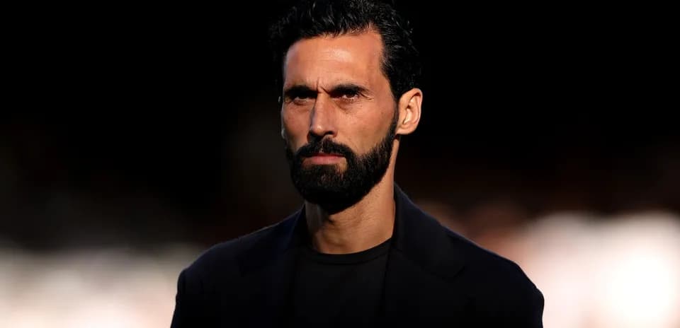 Man with beard looking seriously at the camera