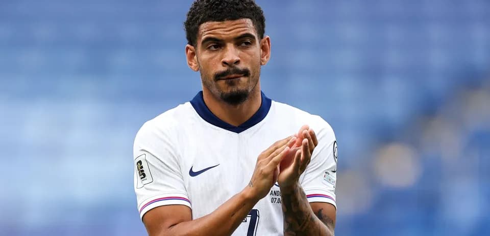 Player applauding on the field in team uniform