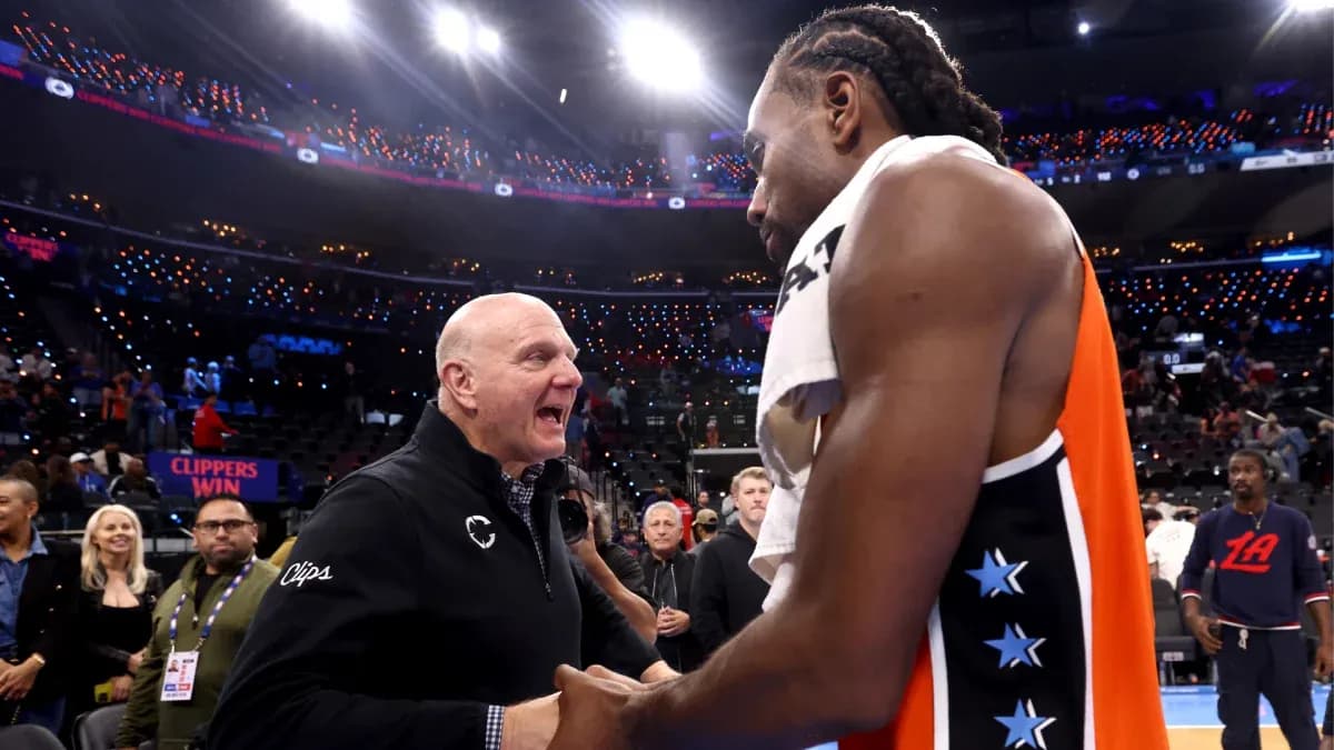 Kawhi Leonard and team owner celebrating post-game