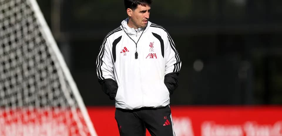 Coach observing players during training session at Liverpool