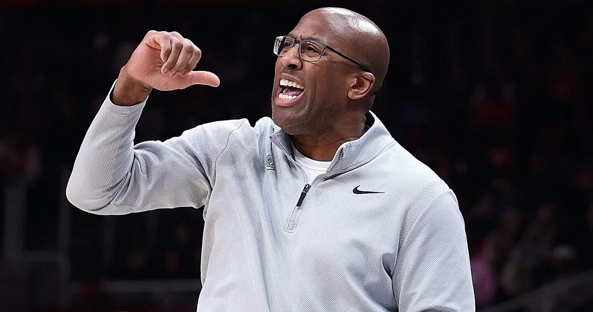 Coach gesturing and shouting during basketball game