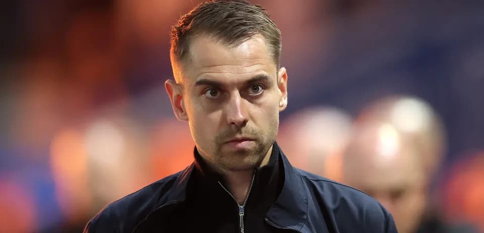 Man in jacket walking towards the camera