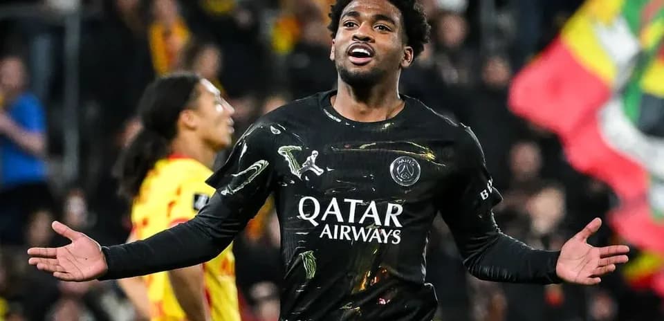 Player celebrating during match wearing PSG jersey