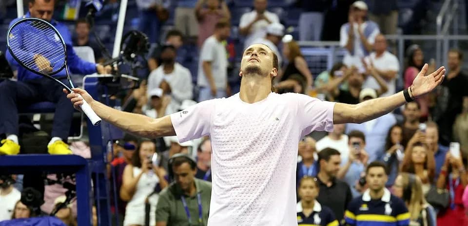 Player celebrating after winning a tennis match