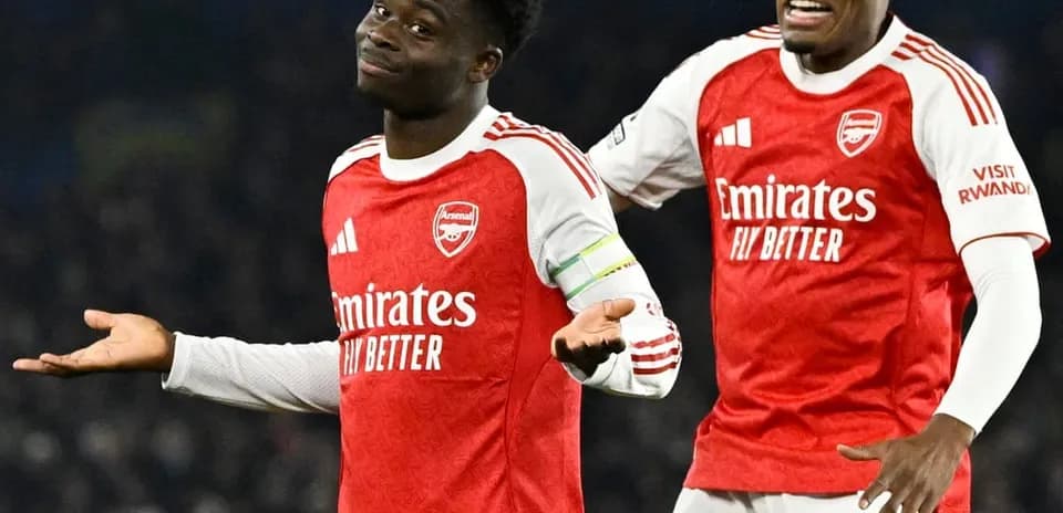 Two Arsenal players celebrating during match