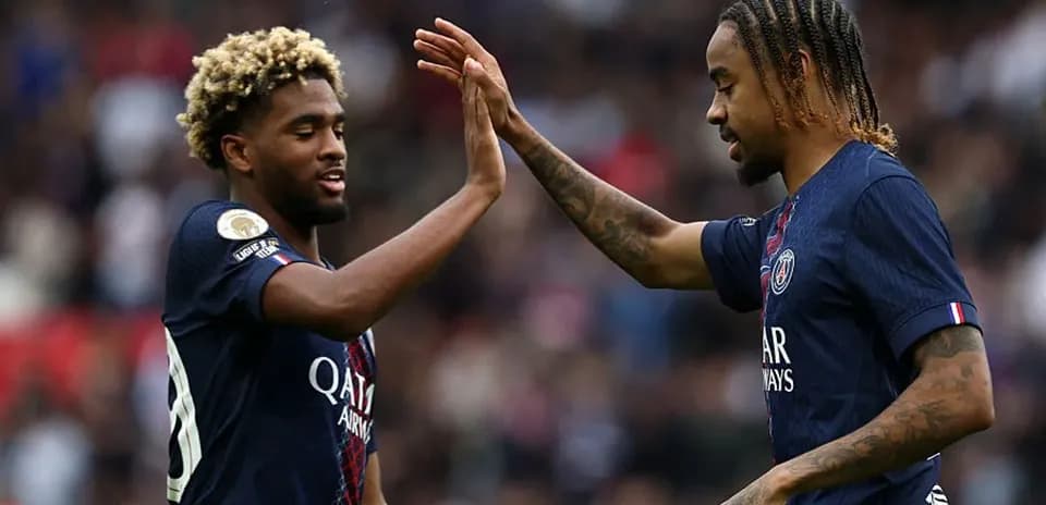 Two Paris Saint-Germain players celebrating a play
