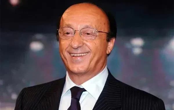 Man in suit smiling at event