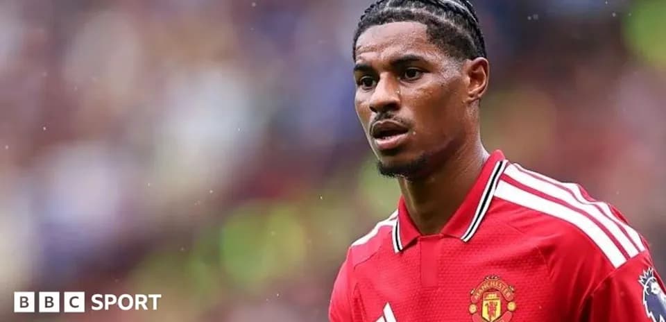 Player wearing Manchester United jersey on field