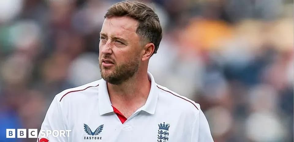Cricketer wearing England team jersey on field