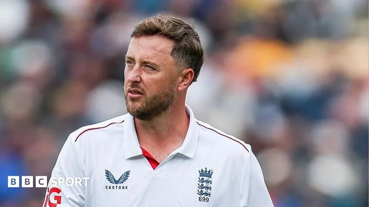 Cricketer wearing England team jersey on field