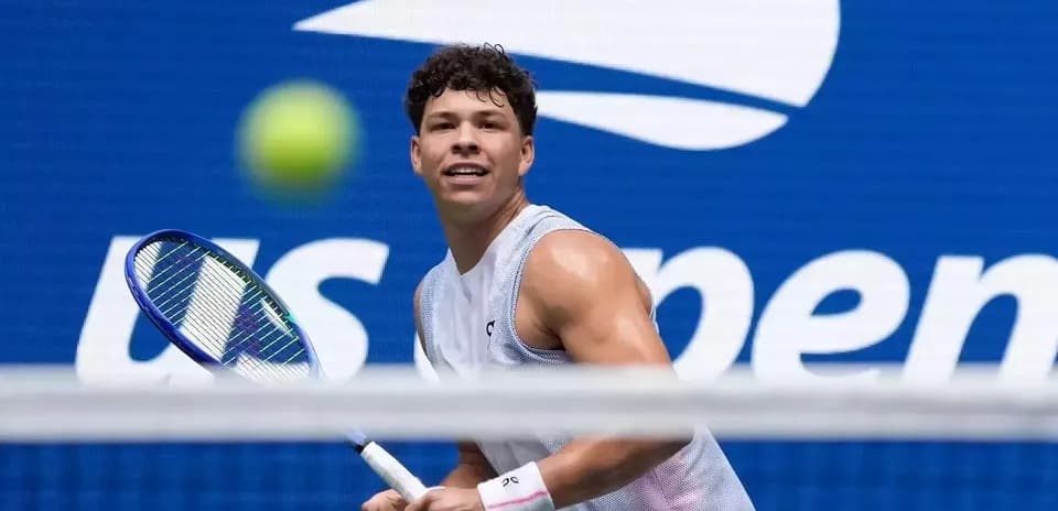 Tennis player preparing to hit a ball during match