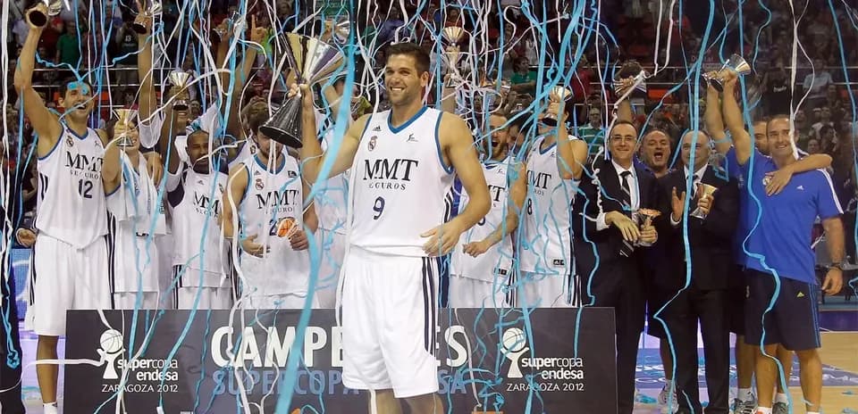 Team celebrating victory with trophies and confetti