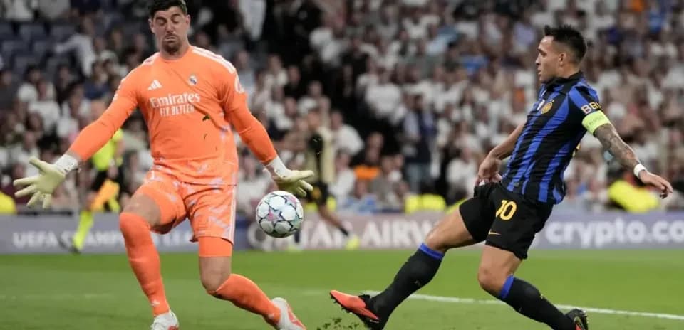 Goalkeeper blocking a shot during a match