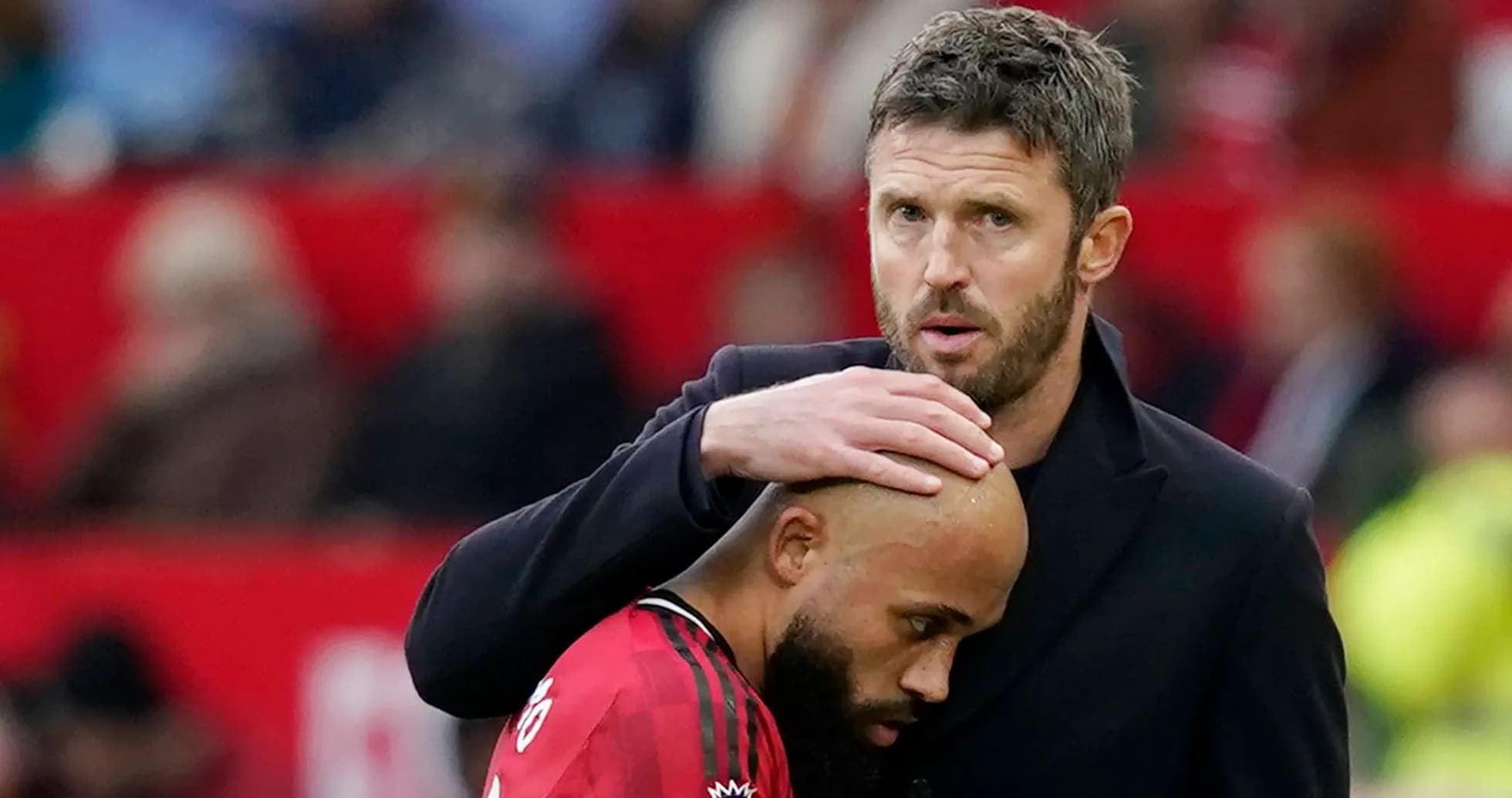 Coach comforting player during match at stadium Coach comforting player during match at stadium