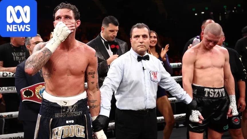 Boxers with referee after match in ring Boxers with referee after match in ring