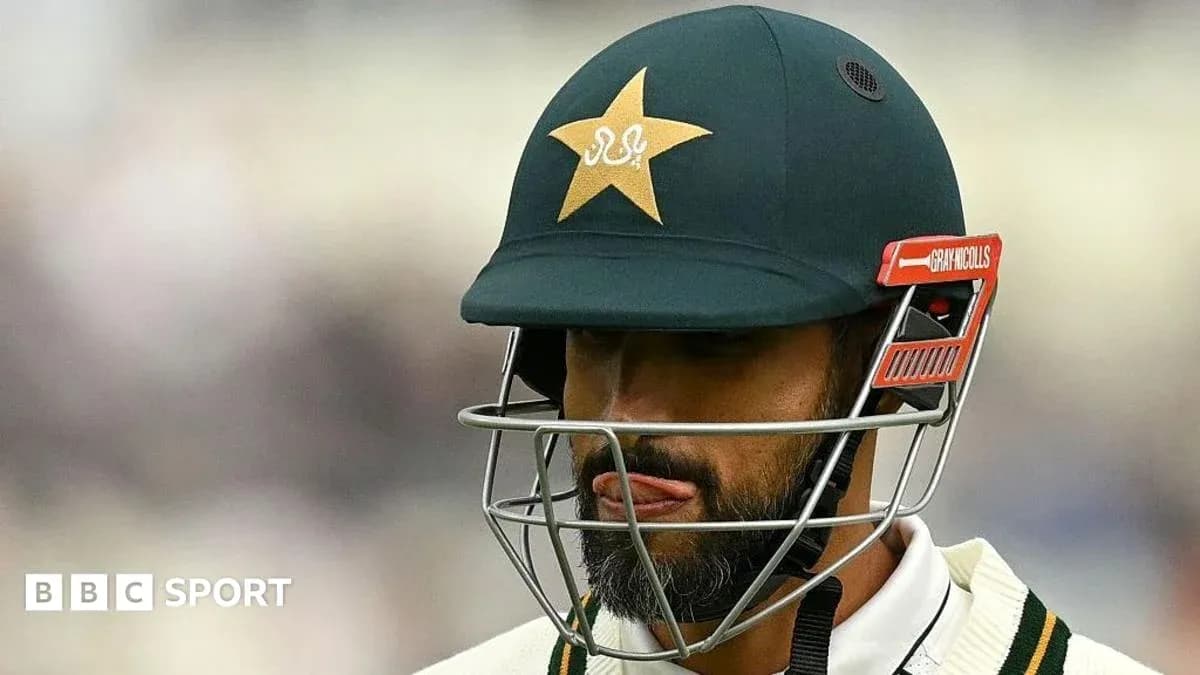 Cricketer wearing helmet during a match Cricketer wearing helmet during a match