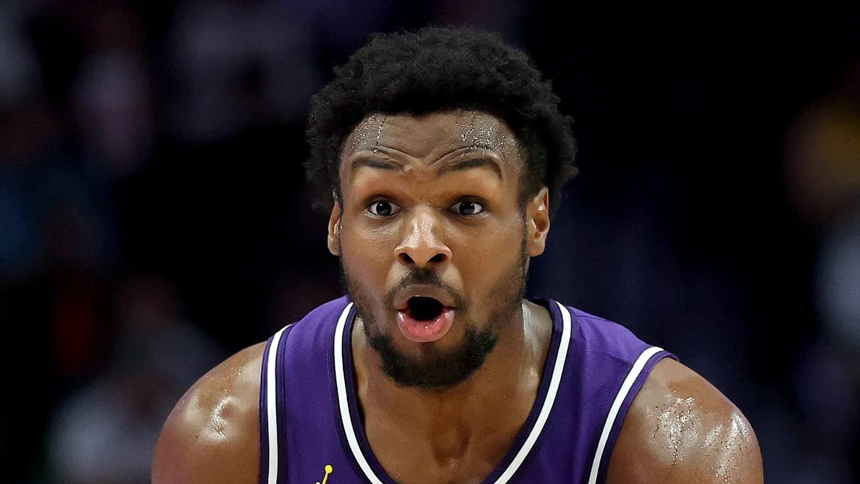 Player in purple jersey reacting during a game Player in purple jersey reacting during a game