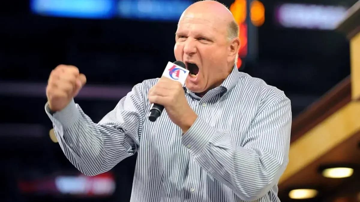 Man passionately speaking into a microphone at event Man passionately speaking into a microphone at event