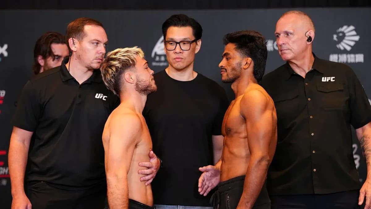 Two fighters facing off at UFC weigh-in event Two fighters facing off at UFC weigh-in event