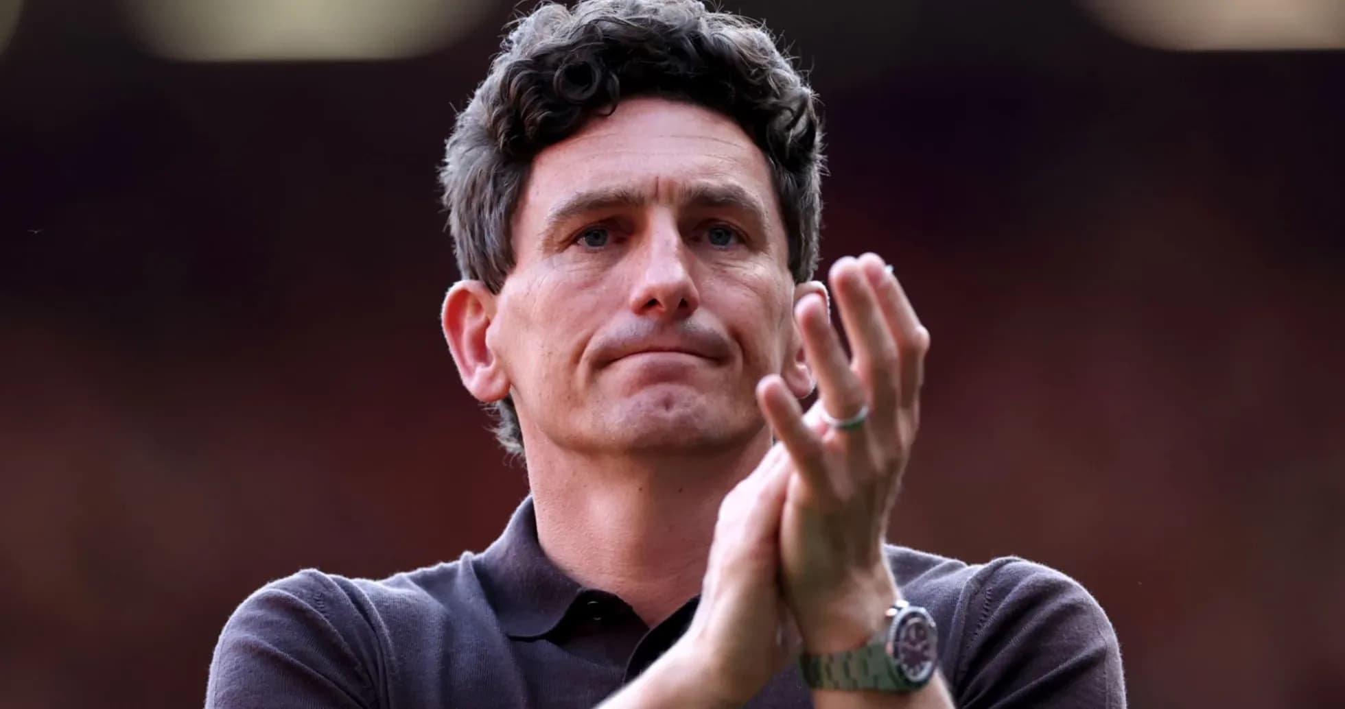 Man clapping during a sports event Man clapping during a sports event