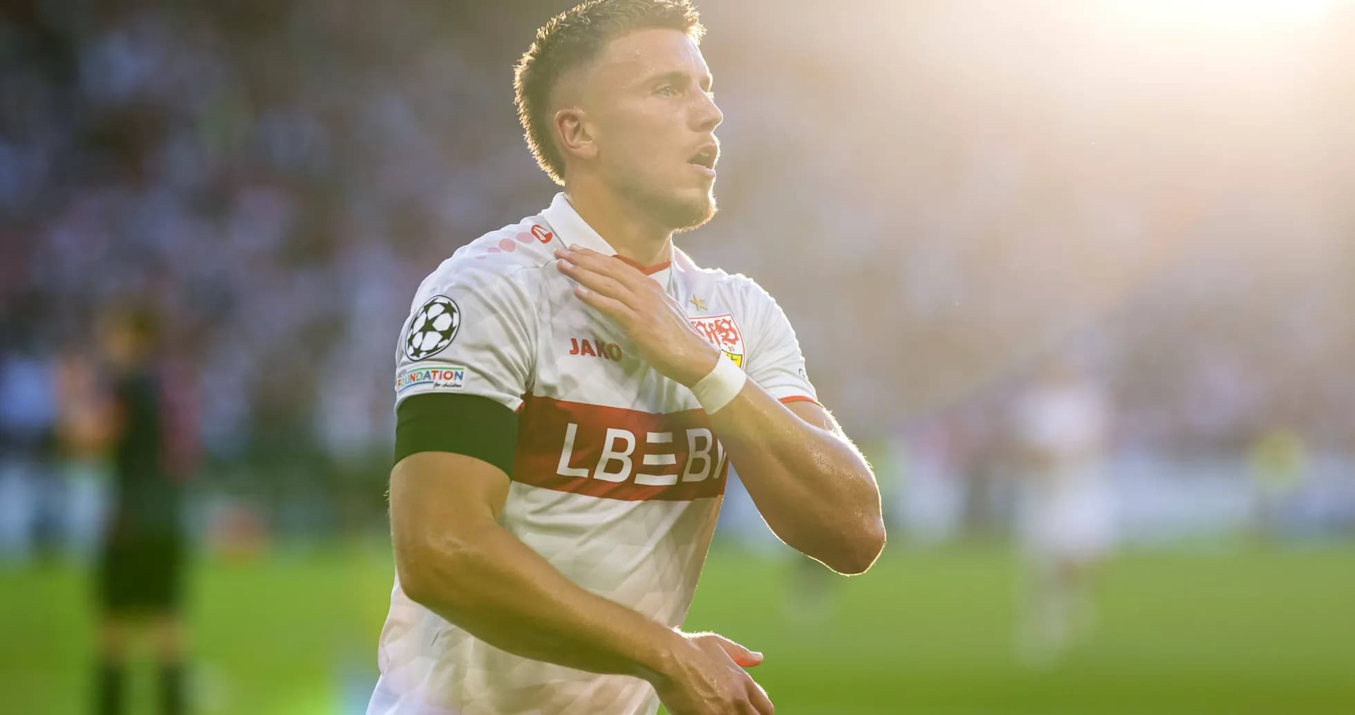 Player celebrating during a UEFA Champions League match Player celebrating during a UEFA Champions League match
