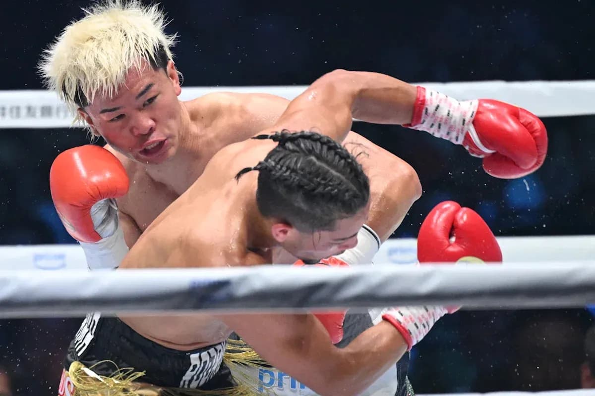 Boxers exchanging punches during a match Boxers exchanging punches during a match