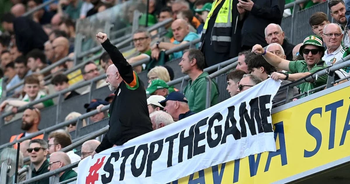 Fans holding banner and cheering in stadium stands Fans holding banner and cheering in stadium stands